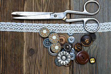 Image showing antique buttons, lace and a tailor scissors