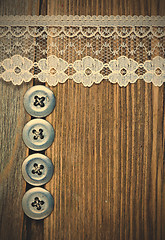 Image showing vintage button and lace tape