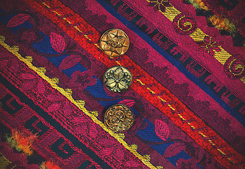 Image showing vintage tape with embroidered ornaments and old buttons