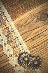 Image showing vintage button and lace tape