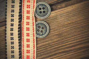 Image showing vintage bands with embroidered ornaments and old buttons