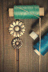 Image showing vintage buttons flowers and spools with threads