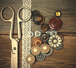 Image showing vintage buttons, tape lace and a tailor scissors 