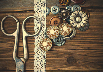 Image showing several vintage buttons, lace, and a dressmaker scissors