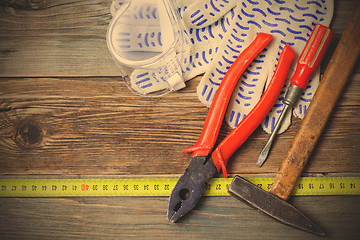 Image showing old tools on aged boards