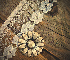 Image showing vintage button and lace tape