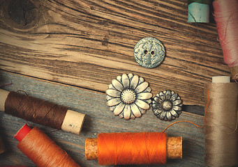 Image showing vintage reels of varicolored thread and old buttons