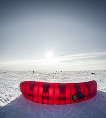 Image showing Kiteboarder with kite on the snow