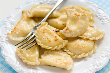 Image showing Fried in butter dumplings with cottage cheese.