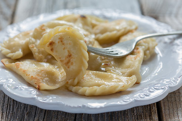 Image showing Fried dumplings with cottage cheese.