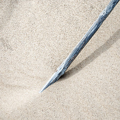 Image showing pole standing in the sand