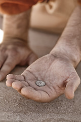 Image showing Beggar hand with coin