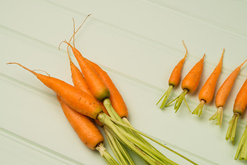 Image showing Carrots on wooden table