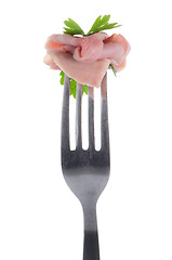 Image showing Slice of ham skewered on a fork 