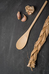 Image showing Wooden spoon and garlic 