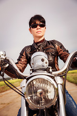 Image showing Biker girl on a motorcycle