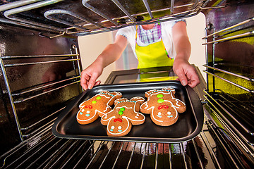 Image showing Baking Gingerbread man in the oven