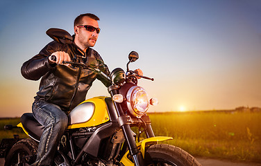 Image showing Biker on a motorcycle