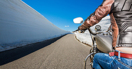 Image showing Biker girl First-person view, mountain serpentine.