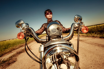 Image showing Biker girl on a motorcycle