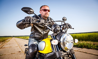 Image showing Biker on a motorcycle