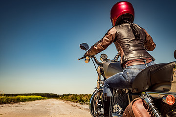 Image showing Biker girl on a motorcycle