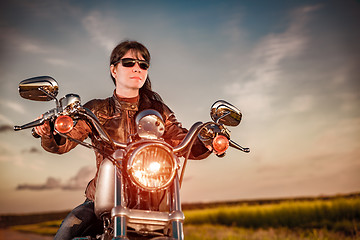 Image showing Biker girl on a motorcycle