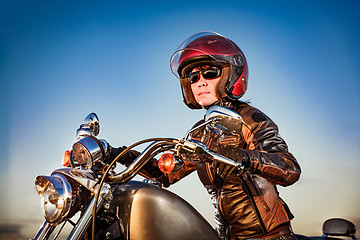 Image showing Biker girl on a motorcycle