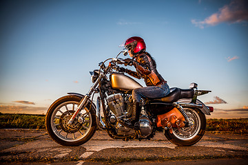 Image showing Biker girl on a motorcycle