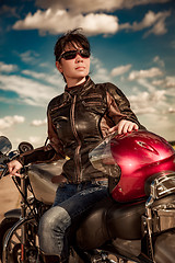 Image showing Biker girl on a motorcycle