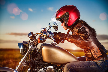 Image showing Biker girl on a motorcycle