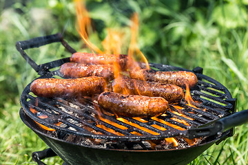 Image showing Grilling sausages 