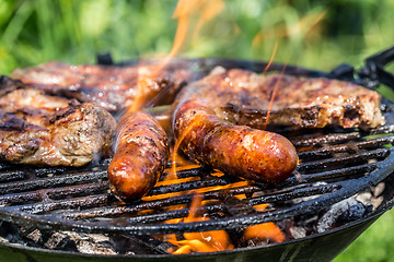Image showing Grilling sausages