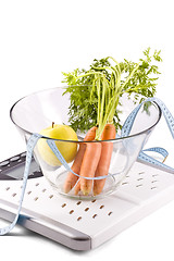 Image showing carrots, apple and measuring objects