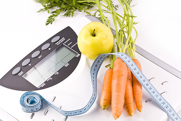 Image showing carrots, apple and measuring objects