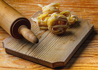 Image showing Rolling pin with pasta