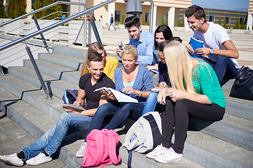 Image showing students outside sitting on steps