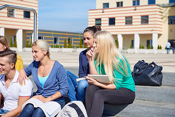 Image showing students outside sitting on steps