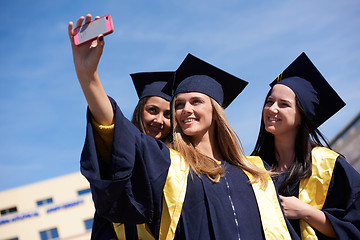 Image showing students group in graduates making selfie