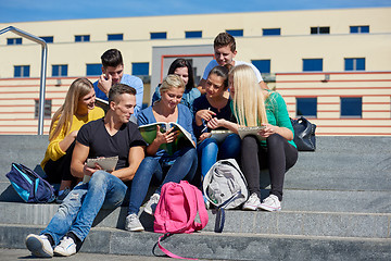 Image showing students outside sitting on steps