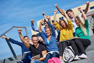 Image showing students outside sitting on steps