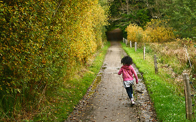 Image showing Girl running in a path in the nature