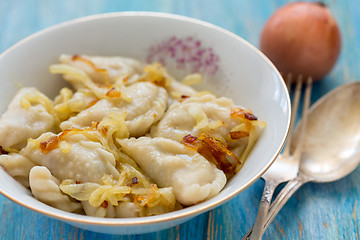 Image showing Dumplings with potatoes and fried onions.