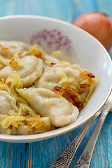 Image showing Dumplings with fried onions