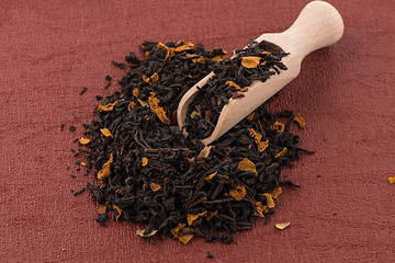 Image showing Black Dry Tea with a Wooden Spoon