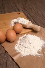 Image showing Flour spoon and eggs