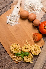 Image showing Raw pasta, tomato and eggs