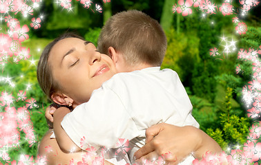 Image showing happy mother and son with flowers