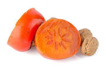 Image showing Ripe persimmons and nuts