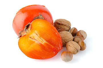 Image showing Ripe persimmons and nuts